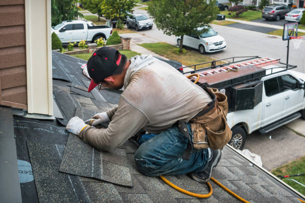 Professional Roofing technician working in Hemlock, IN